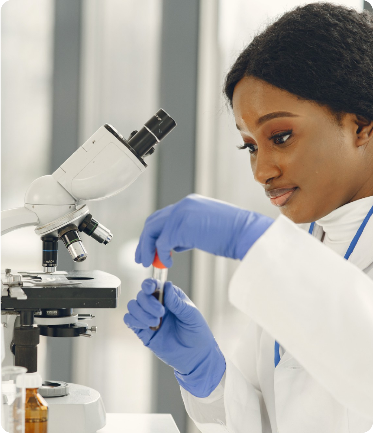 Scientist working with microscope